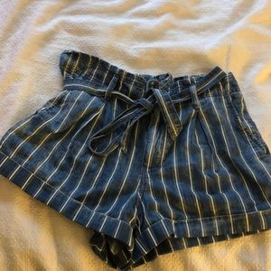 Blue and white striped denim paper bag shorts